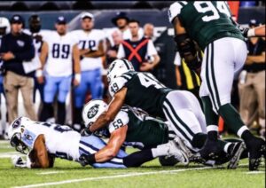 Former NFL linebacker and NCAA all-time leading tackler Connor Harris delivering a powerful tackle in-game, showcasing the explosive energy and physical durability supported by Proven4 NSF Certified for Sport supplements.